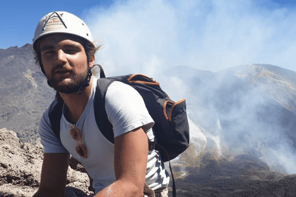 Geoffrey (Jeff) Robert hiking near an active volcano.