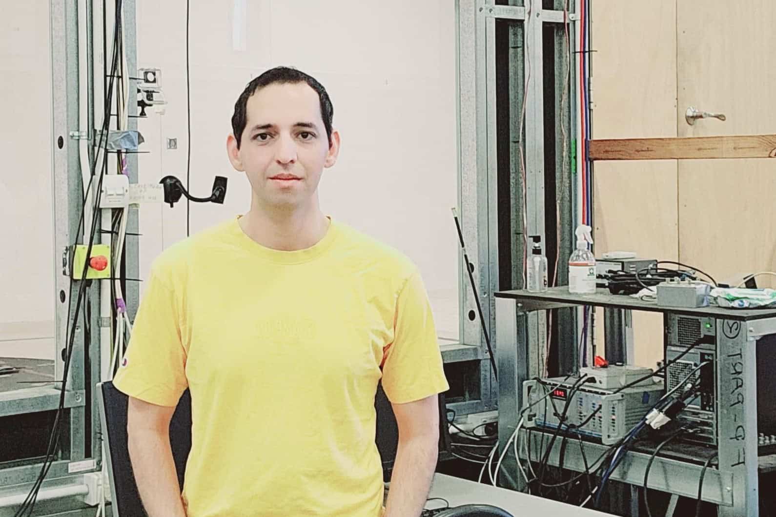 Mehrdad Aghamohammadi Mehrdad Aghamohammadi standing in front of the wind tunnel
